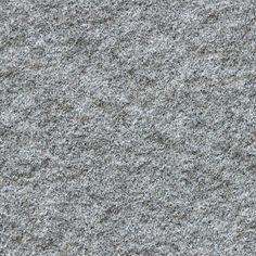 a close up view of the surface of a gray granite wall or floor with small cracks in it