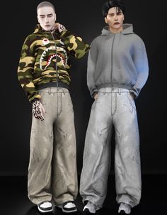 two young men standing next to each other in front of a black background with a shark on it's hoodie