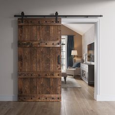 an open wooden door leading to a living room