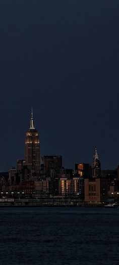 an airplane is flying over the city at night