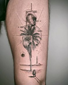 a man with a tattoo on his leg that has a palm tree in the middle