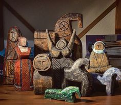 several wooden figurines sitting on top of a table