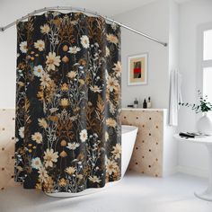 a shower curtain with flowers on it in a bathroom