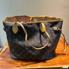 Vintage Louis Vuitton Authentic "Neverfull" Has some worn areas around the Top Trim that can be seen in Photos Has some Black Spots That can Be seen in the Photos This is LV's Most Popular Bag Popular Bags, Top Handle Bags, Vintage Louis Vuitton, Black Spot, Purses And Handbags, Top Handle, Labour Day, Most Popular, Top Handle Bag