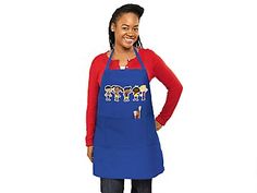 a woman wearing an apron with cartoon characters on it