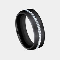 a black ring with white diamonds on it