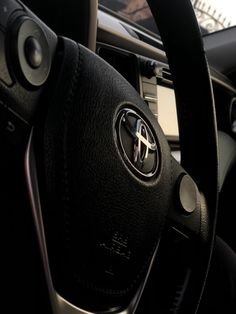 the steering wheel and dashboard of a car