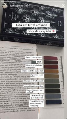 an open book sitting on top of a table next to some type of color swatches