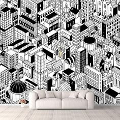 a living room with a couch and large wall mural in black and white cityscape