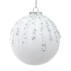 a white christmas ornament hanging from a string