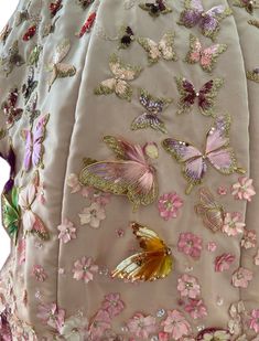 the back of a dress with butterflies on it