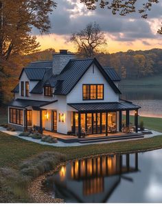 a white house sitting next to a body of water