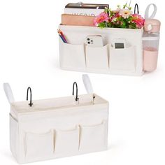 two white storage bins with flowers in them and one holding a cell phone,