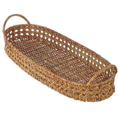 an empty wicker basket with handles is shown on a white background for use as a serving tray