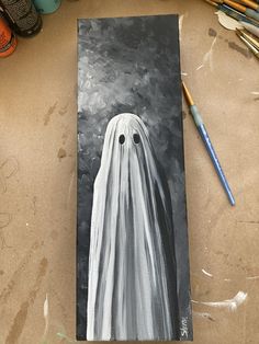 a painting of a ghost with two eyes on it