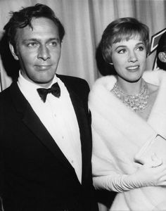 an old black and white photo of two men and a woman in tuxedo