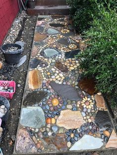 a walkway made out of rocks and gravel