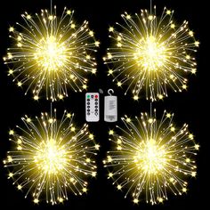 four fireworks with remote controls in the middle and one on the other side, set against a black background