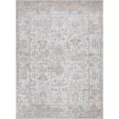 a rug with an ornate design on the front and back side, in grey tones