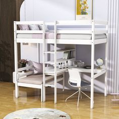 a white bunk bed sitting on top of a hard wood floor next to a desk