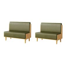 a pair of green leather chairs with wooden legs and armrests on white background