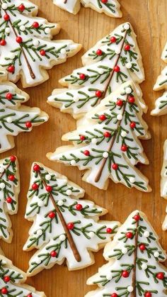 christmas cookies decorated with white icing and red berries are on a wooden surface, the words 30 cute ideas for christmas cookies