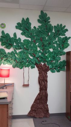 a tree made out of paper on the wall