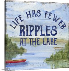 a wooden sign that says life has few ripples at the lake with a boat on it