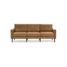 a brown leather couch with wooden legs on a white background in front of a white backdrop