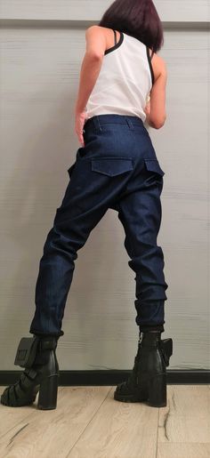 "Extravagant Denim Pants, Harem Casual Pants, Urban Pants, Loose Pants, Punk Pants, Gothic Pants, Outer pockets, New collection ❤️ Extravagant designs and high quality fabrics! ❤️ Materials & Care Denim Hand wash at low temperatures. Do not machine dry. Do not iron. Do not dry clean! ❤️ Sizing We can make your piece from XS to 5XL! Everything in the shop can be also made according to your measures free of charge! ❤️ Shipping ✈ Ready to ship The time I need to prepare an order for shipping va Punk Style Wide Leg Jeans, Baggy Denim Blue Cargo Pants With Belt Loops, Edgy Baggy Denim Bottoms, Baggy Denim Bottoms With Edgy Style, Baggy Denim Punk Pants, Punk Style Baggy Straight Leg Bottoms, Edgy Baggy Denim Blue Bottoms, Utility Style Denim Trousers, Utility Denim Trousers