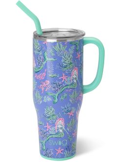 a blue and pink cup with a green straw sticking out of it's side