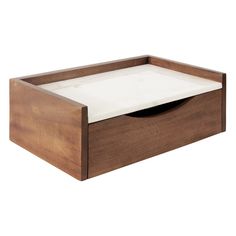 a wooden box with a white sheet in the bottom and two drawers on each side