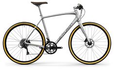 a silver bike with yellow rims is shown