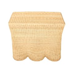 a wicker stool with scalloped edges on an isolated white background for use as a side table