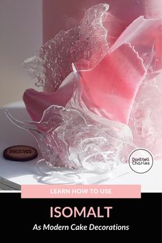 a cake with icing on it and the words, learn how to use isomalt as modern cake decorations