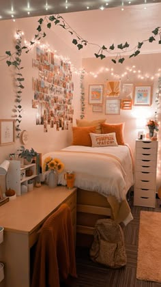 a bedroom decorated with string lights and pictures on the wall