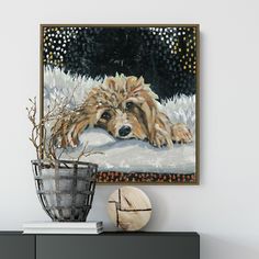 a painting of a dog laying down in the snow next to a potted plant