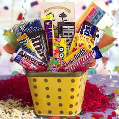 a yellow basket filled with candy and confetti