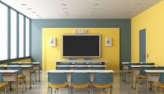 an empty classroom with desks, chairs and a flat screen tv on the wall