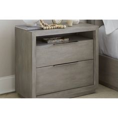 a night stand with two drawers and a clock on top