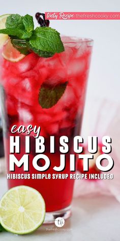 Glass filled with hibiscus mojito, a bright pinkish red drink in a tall glass with mint and lime. Mocktails Non Alcoholic Hibiscus, Drinks With Hibiscus Syrup, Hibiscus Tea Mocktail, Hibiscus Tea Mock Tail, Hibiscus Vodka Cocktail, Mocktails Hibiscus, Hibiscus Syrup Recipes