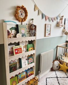 a bookshelf in a child's room with toys on the floor and wall