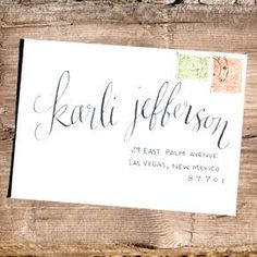 a close up of a business card on a piece of wood with the words karli jefferson