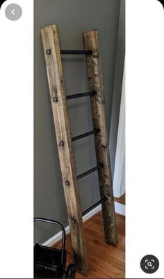 an old wooden ladder leaning against the wall