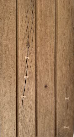 a close up of some wood on a wall