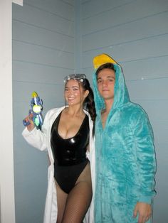 two people dressed in costumes standing next to each other