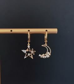 "Dainty Star and Moon Dangle Earrings \"I want to be in love with you the same way I am in love with the moon with the light shining out of its soul.\" -- Sanober Khan All earrings will ship with backs and extra backs :) Gift packaging available for all occasions, Just hit me up! Sterling silver posts are naturally soft due to the high silver content (just bend them back into shape if they get out of whack). Clean your jewelry after each wearing with a soft cloth. I LOVE earrings. But I only hav Gay Jewelry, In Love With The Moon, Moon Earring, To Be In Love, Pretty Jewelry Necklaces, Fairy Jewelry, Love Earrings, Star And Moon, Magical Jewelry