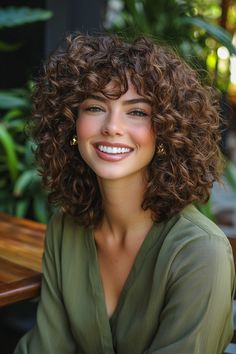 Embrace the beauty of curly hairstyles with this dynamic choppy layers look! Perfect for adding movement and texture, the choppy layers beautifully frame your face while enhancing the natural bounce of your curls. This hairstyle not only elevates your curls but also offers a playful vibe that’s ideal for any occasion. Discover how choppy layers can transform your curly hairstyles into a statement of style! Short Hair With Curly Hair, Curly Hair Short With Bangs, Highlights For Curly Hair Natural Curls Brunettes, Short Curly Layered Haircuts, Hair Color For Curly Hair Natural Curls, Face Framing Curly Haircut, Curly Layered Bob With Bangs, Shorter Curly Hair, Curly Perm Before And After