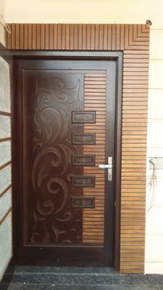 a wooden door with decorative designs on it