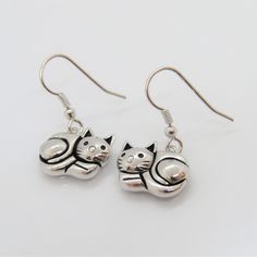 Vintage Sterling Silver Cat Dangle Earrings...Marked 925...Total of weights 4.0grams...Measure H 1'' W 1/2''...These are very good condition. Metal Cat Design Drop Earrings, Cat Design Metal Drop Earrings, Silver Cat Design Dangle Earrings, Silver Cat Design Drop Earrings, Silver Drop Earrings With Cat Design, Sterling Silver Cat, Silver Cat, Cat Jewelry, Cat Earrings